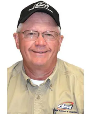 A man wearing glasses and a hat.