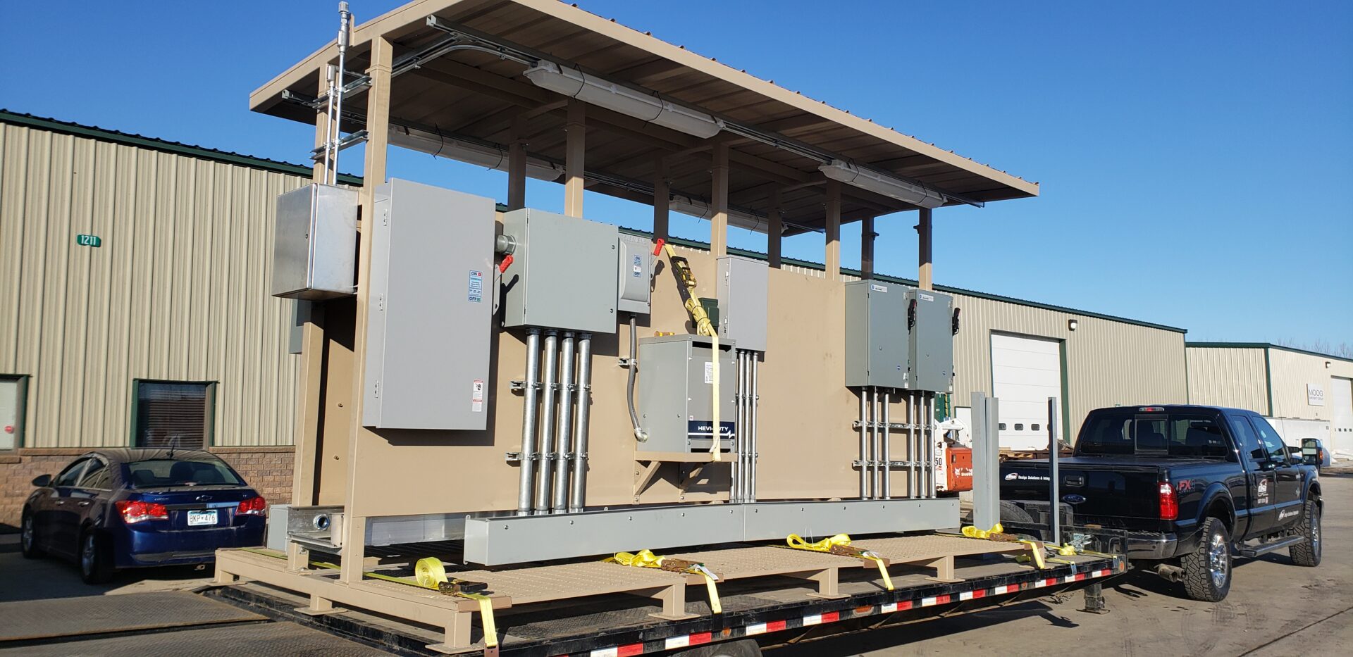 Custom fabricated electrical rack with roof.