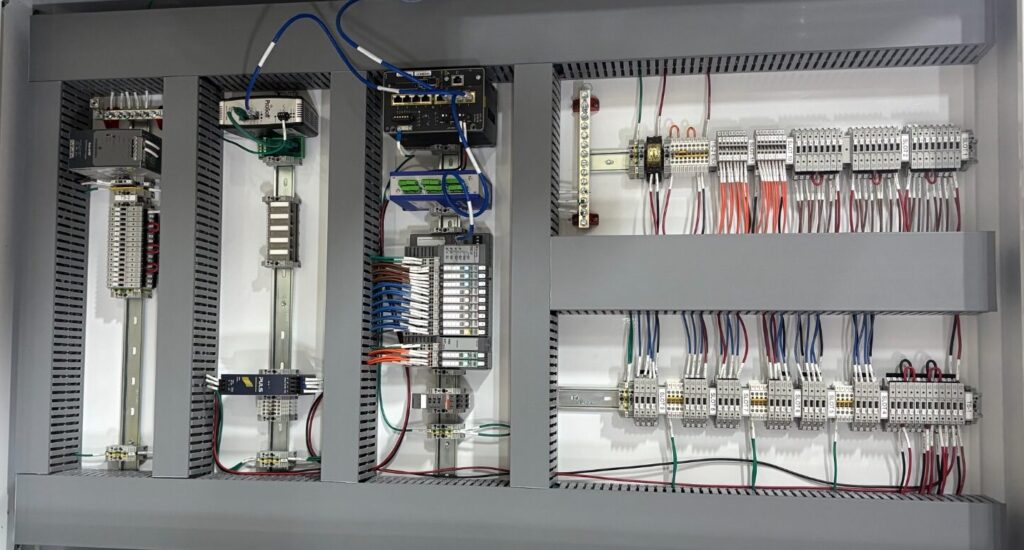 Industrial hazardous location control panel showing organized wiring, terminal blocks, and automation components used in oil and gas operations