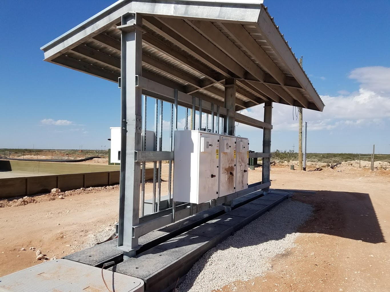 DSI shop-fabricated galvanized electrical rack and canopy after field installation