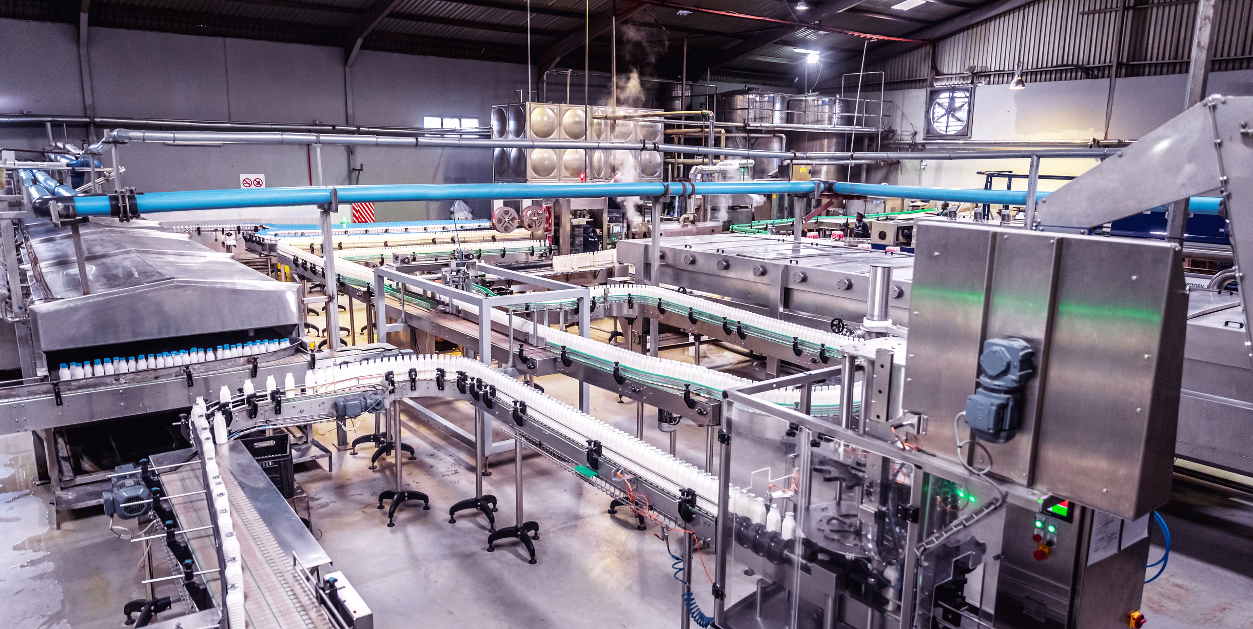 Industrial processing and manufacturing plant floor with production line