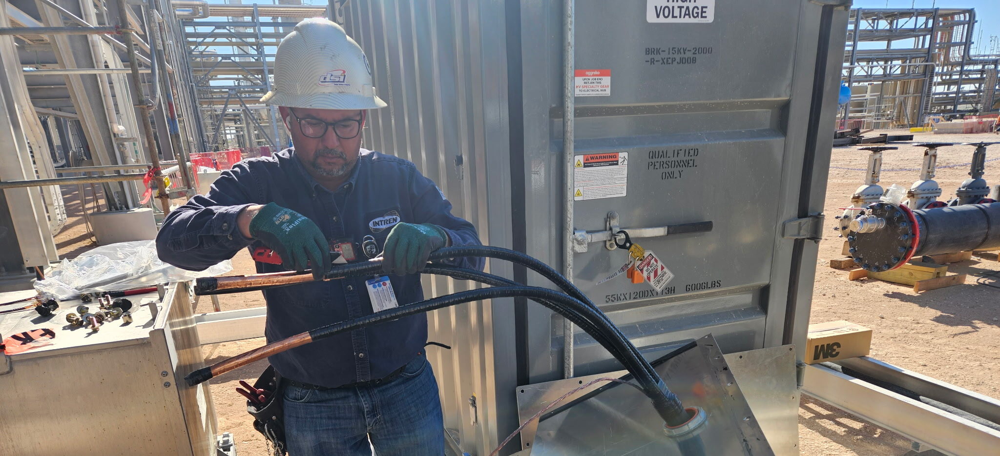 DSI electrician terminating 4/0 cable at a Class I Division 2 hazardous area enclosure on a Bakken well pad