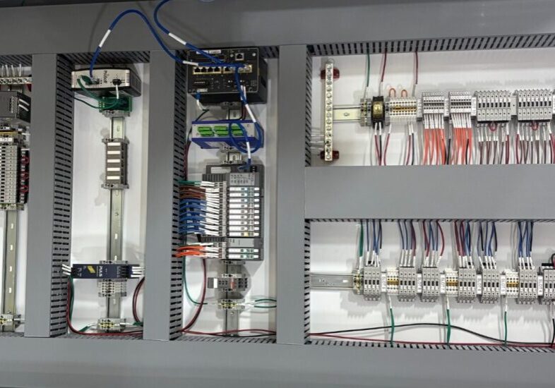 Industrial hazardous location control panel showing organized wiring, terminal blocks, and automation components used in oil and gas operations